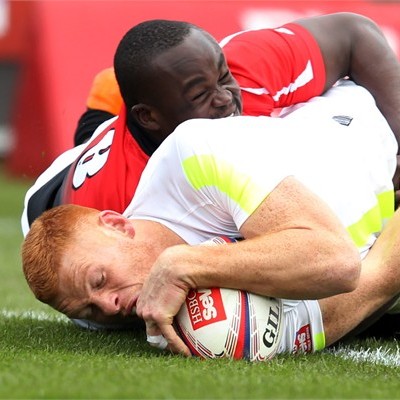James Rodwell of England is tackled by Horace Otieno of Kenya in their pool match of the Glasgow Sevens.(Photo:IRB)