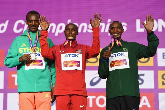 Geoffrey Tanui, the gold medal winner in the men's marathon poses with Ethiopia's Tamirat Tola   and Alphonce Felix Simbu of Tanzania. (Photo Courtesy IAAF)