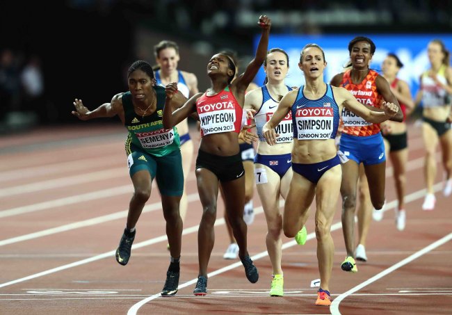 Faith Kipyegon celebrates as she crosses the finish line in the women's 1500m final at the world championships.(Photo by Getty Images for IAAF)