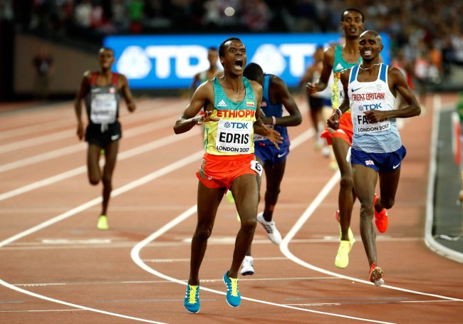 Muktar Edris (Ethiopia) celebrates as he crosses the line ahead of Mohamed Farah (Great Britain).  Yomif Kejelcha (Ethiopia) and Paul Kipkemoi Chelimo (USA. (Getty Images for IAAF)