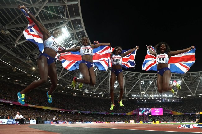 Asha Philip, Deriree Henry, Dina Asher-Smith and Daryll Neita of Great Britain celebrate winning silver in the Women's 4x400 Metres Final. (Getty Images for IAAF)